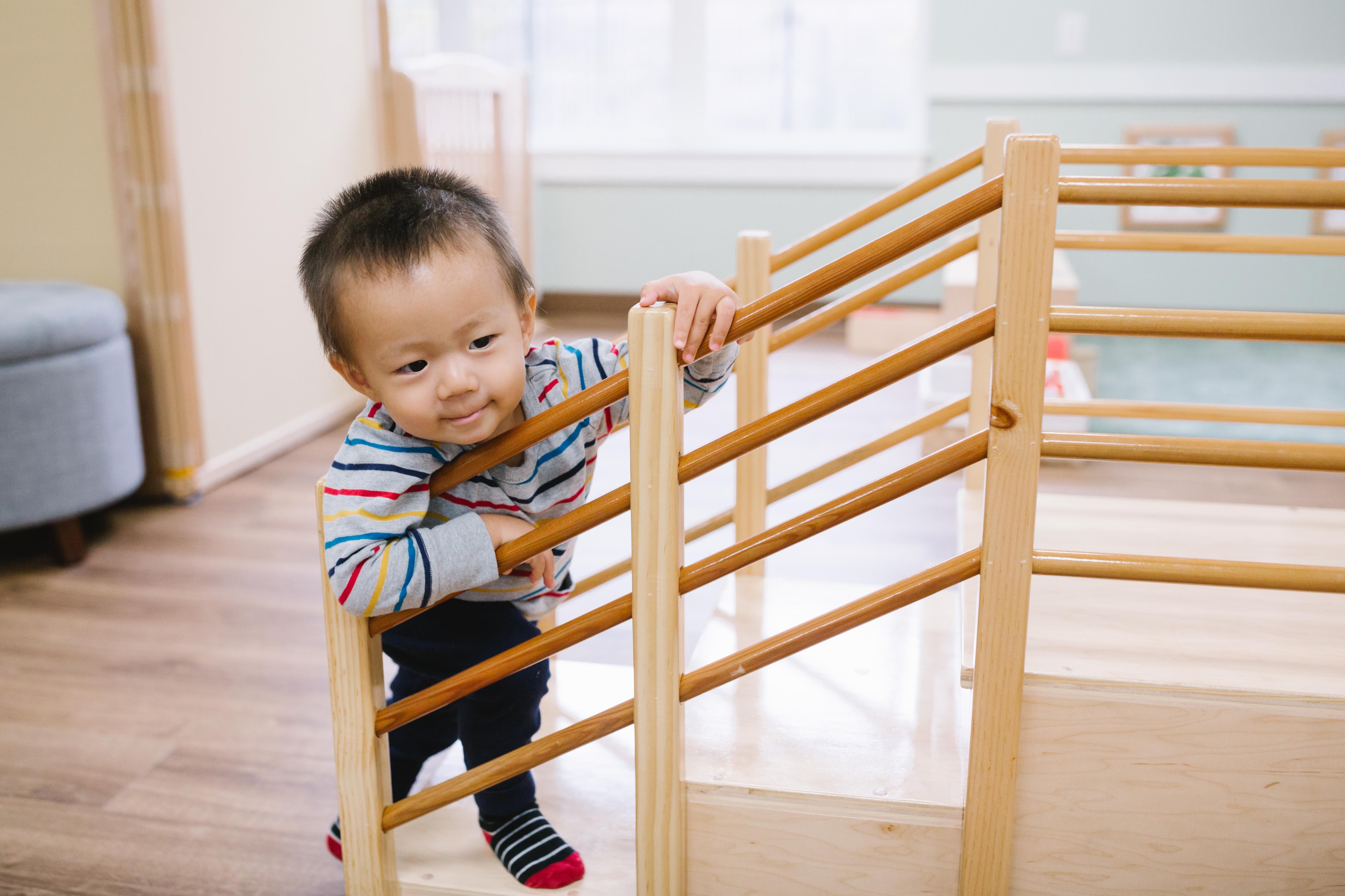 Asian infant on stairs